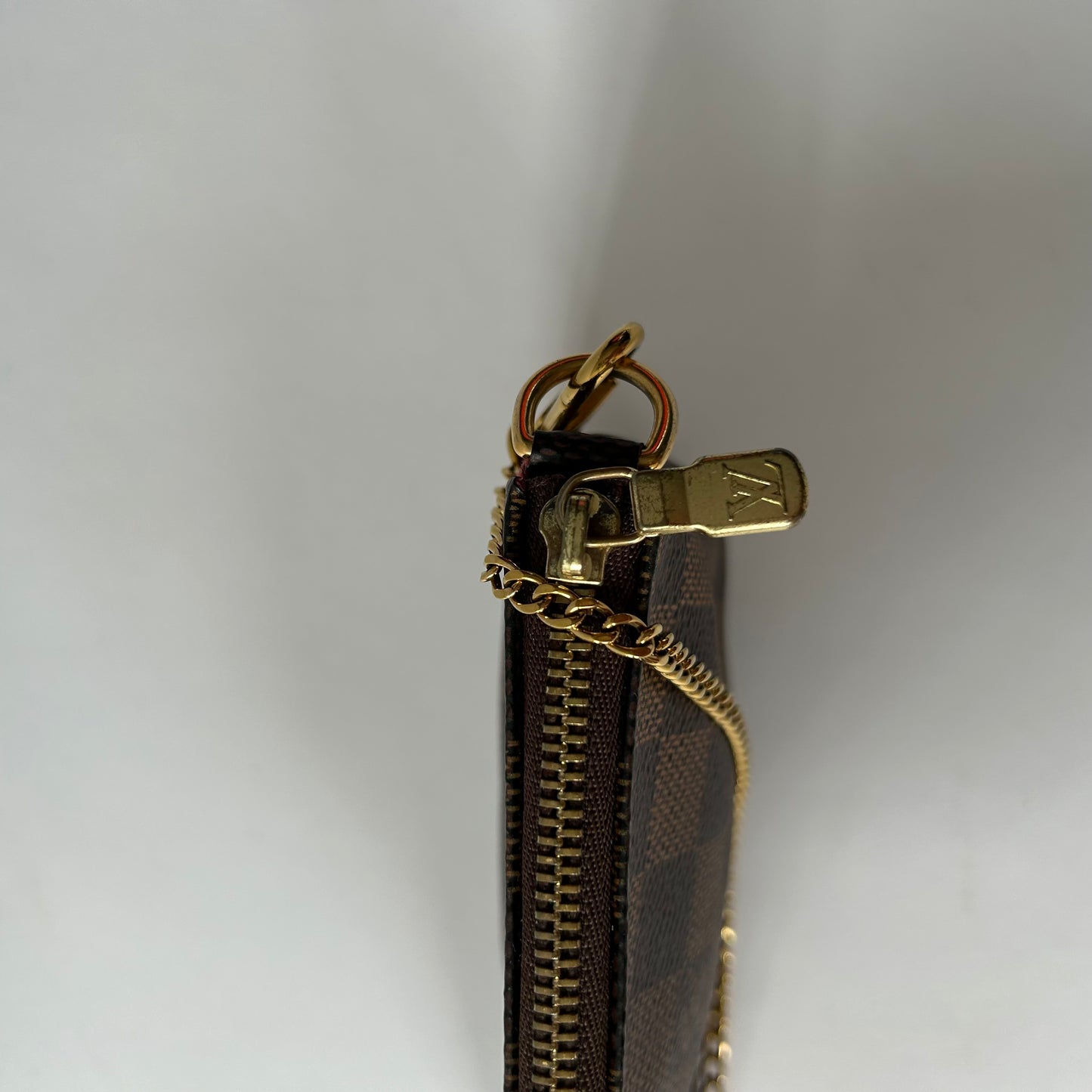 LOUIS VUITTON DAMIER EBENE MINI POCHETTE ACCESSOIRES