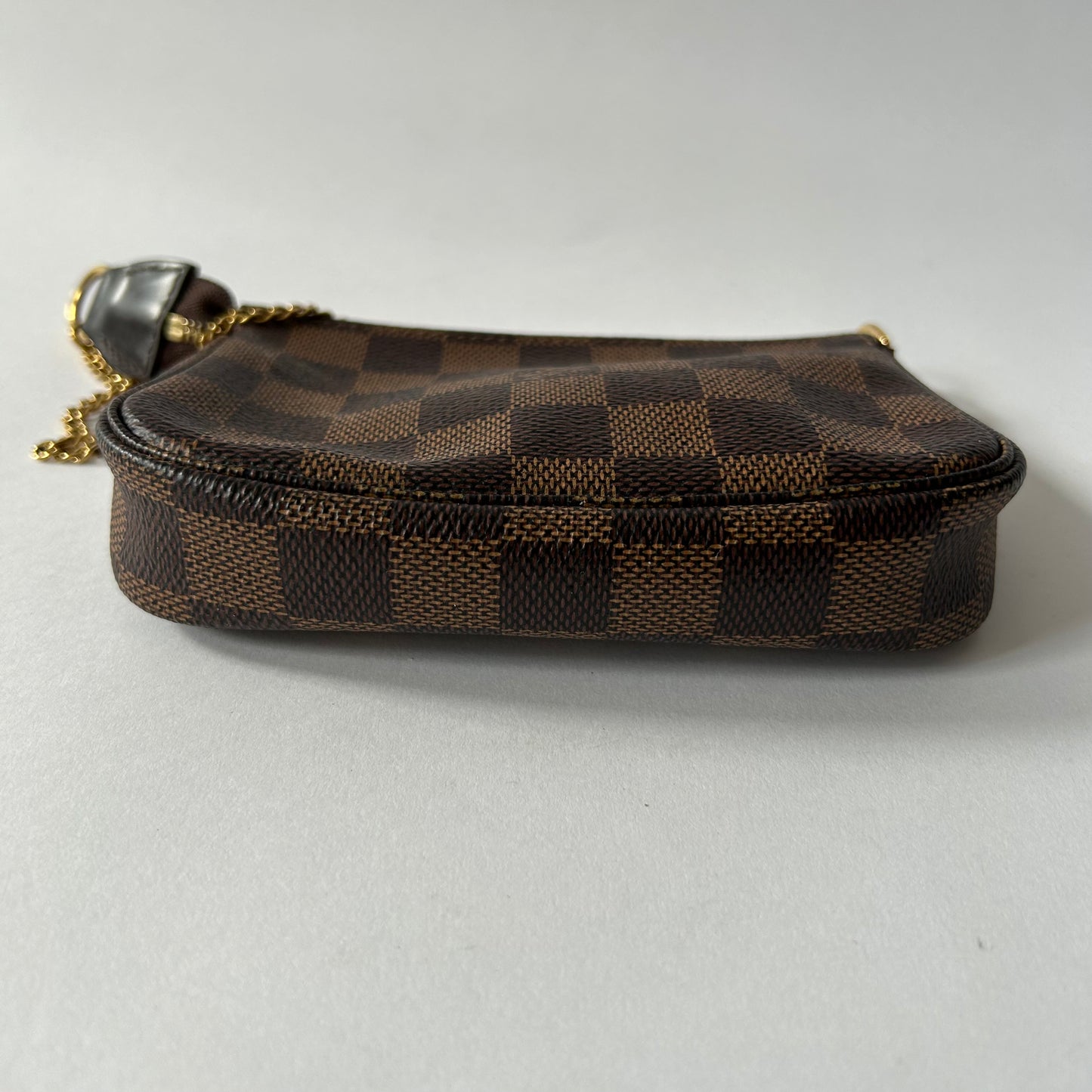 LOUIS VUITTON DAMIER EBENE MINI POCHETTE ACCESSOIRES